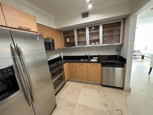 31 SE 5th St Unit 1908, Miami, FL 33131 - kitchen featuring stainless steel appliances, ornamental molding, glass insert cabinets, dark countertops, and light marble finish floors