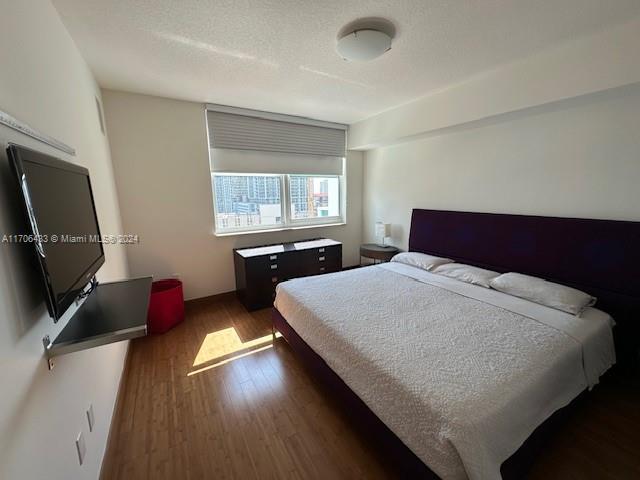 31 SE 5th St Unit 1908, Miami, FL 33131 - bedroom with wood finished floors
