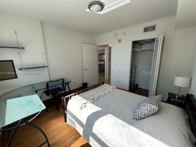 31 SE 5th St Unit 1908, Miami, FL 33131 - bedroom with a closet and wood finished floors