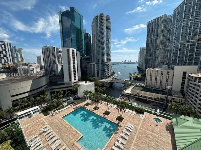 31 SE 5th St Unit 1908, Miami, FL 33131 - community pool with a water view, a skyline view, and a patio area
