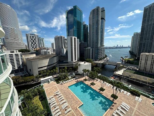 31 SE 5th St Unit 1908, Miami, FL 33131 - community pool with a view of skyline, a water view, and a patio area