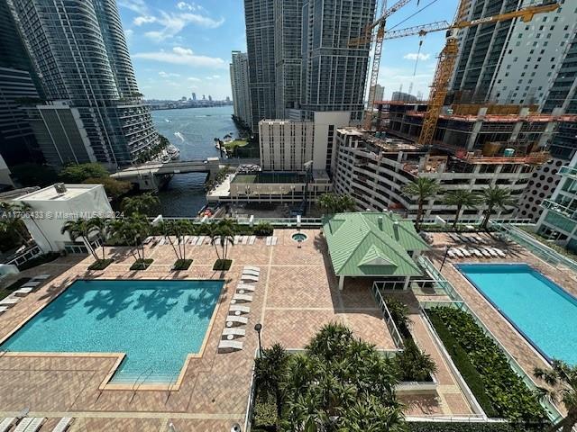 31 SE 5th St Unit 1908, Miami, FL 33131 - community pool featuring a water view, a view of city, and a patio