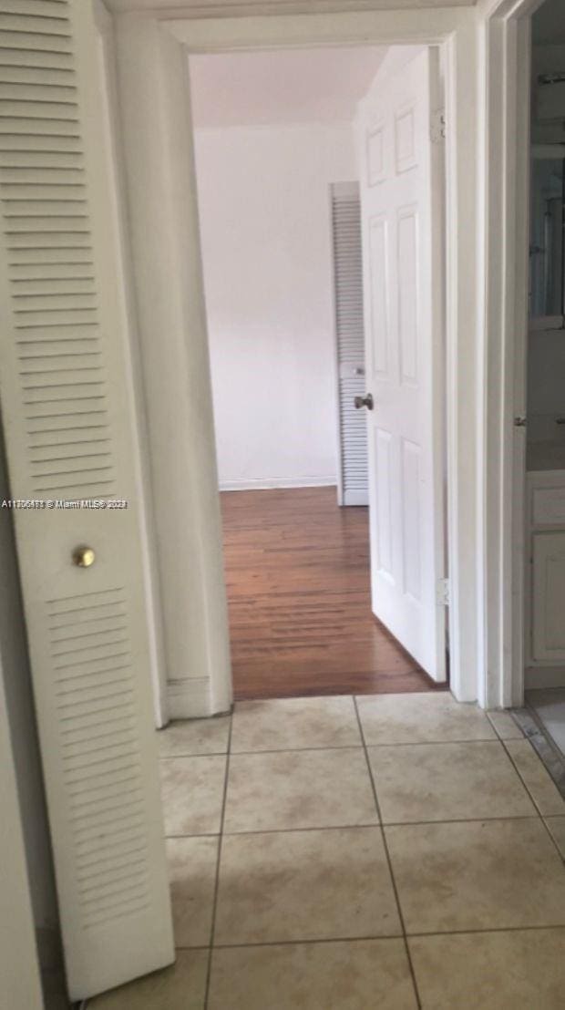 hallway with light wood-type flooring