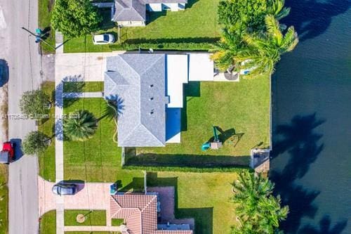 bird's eye view with a water view