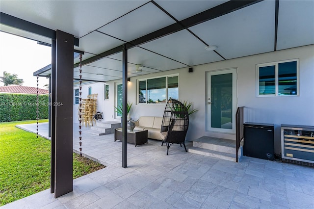 view of patio with an outdoor hangout area and beverage cooler