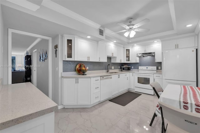 821 Cypress Blvd Unit 304, Pompano Beach, FL 33069 - kitchen featuring white appliances, under cabinet range hood, a sink, ceiling fan, and decorative backsplash