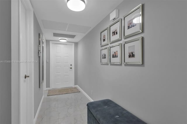821 Cypress Blvd Unit 304, Pompano Beach, FL 33069 - corridor with baseboards and light marble finish floors