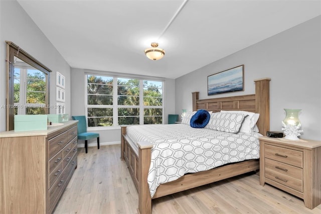 bedroom with light wood-type flooring