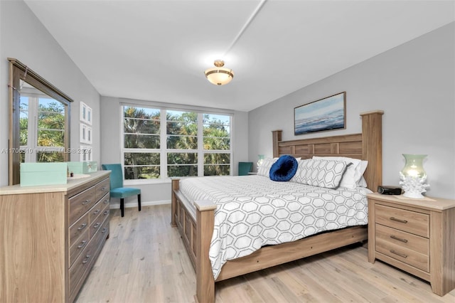 821 Cypress Blvd Unit 304, Pompano Beach, FL 33069 - bedroom with light wood-style flooring, multiple windows, and baseboards