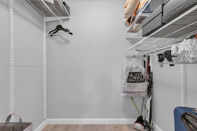 821 Cypress Blvd Unit 304, Pompano Beach, FL 33069 - walk in closet featuring wood finished floors