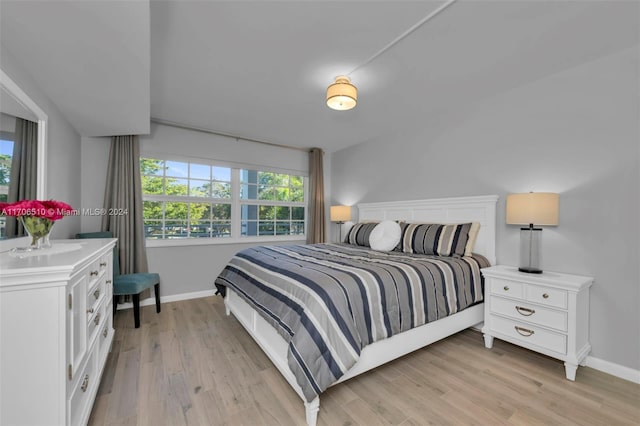 bedroom with light hardwood / wood-style floors