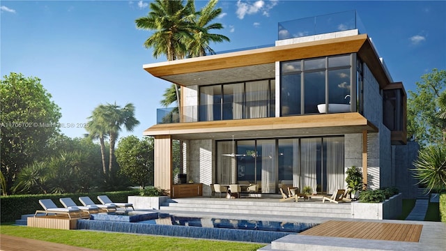 back of property with a balcony, an outdoor pool, and a patio