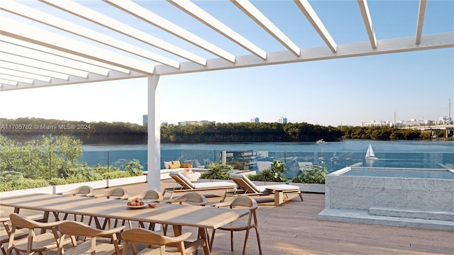 view of patio with a deck with water view and a pergola