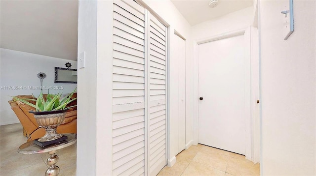 hallway with light tile patterned flooring