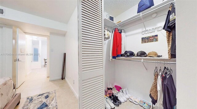 10421 SW 157th Pl Unit 206, Miami, FL 33196 - laundry room featuring light tile patterned floors, laundry area, and washer and clothes dryer