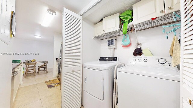 10421 SW 157th Pl Unit 206, Miami, FL 33196 - laundry area featuring light tile patterned floors, laundry area, and washing machine and dryer