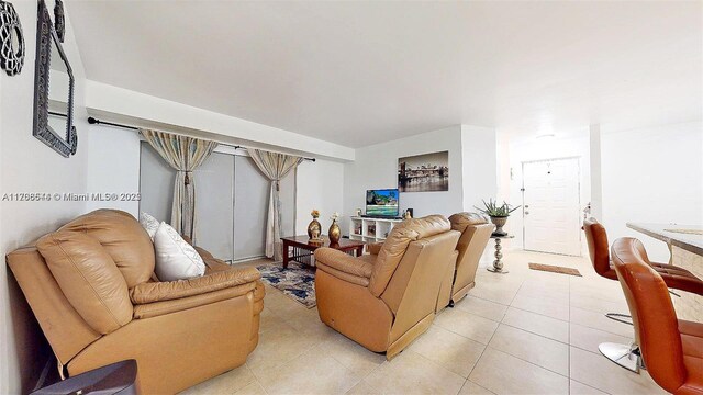 10421 SW 157th Pl Unit 206, Miami, FL 33196 - living room featuring light tile patterned floors
