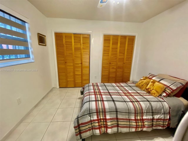 tiled bedroom with two closets