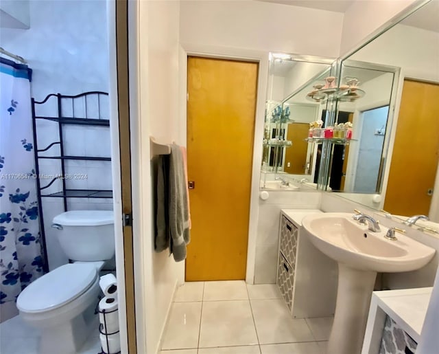 bathroom featuring tile patterned floors and toilet