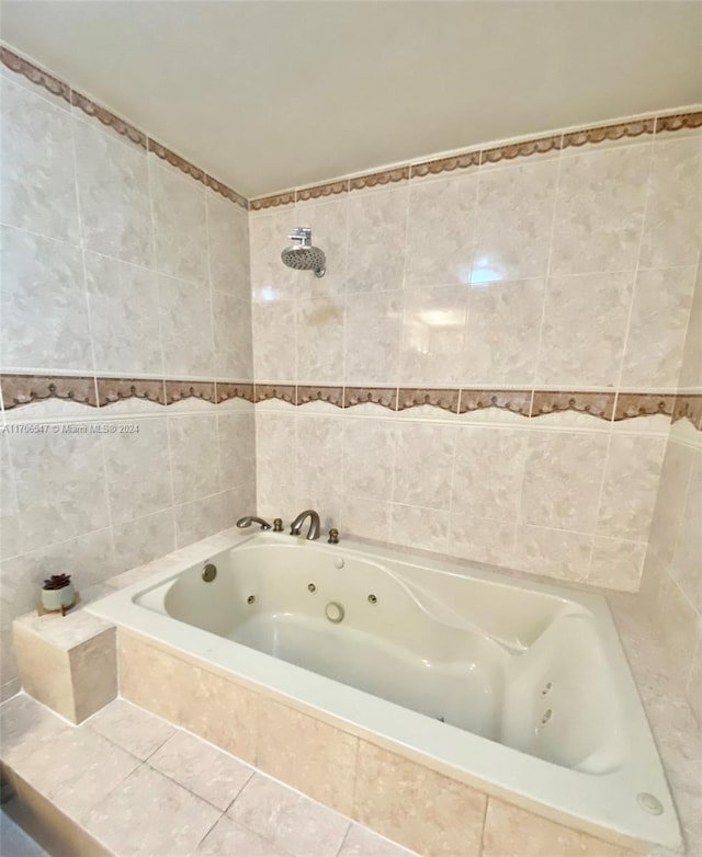 bathroom with tile patterned flooring, shower with separate bathtub, and tile walls