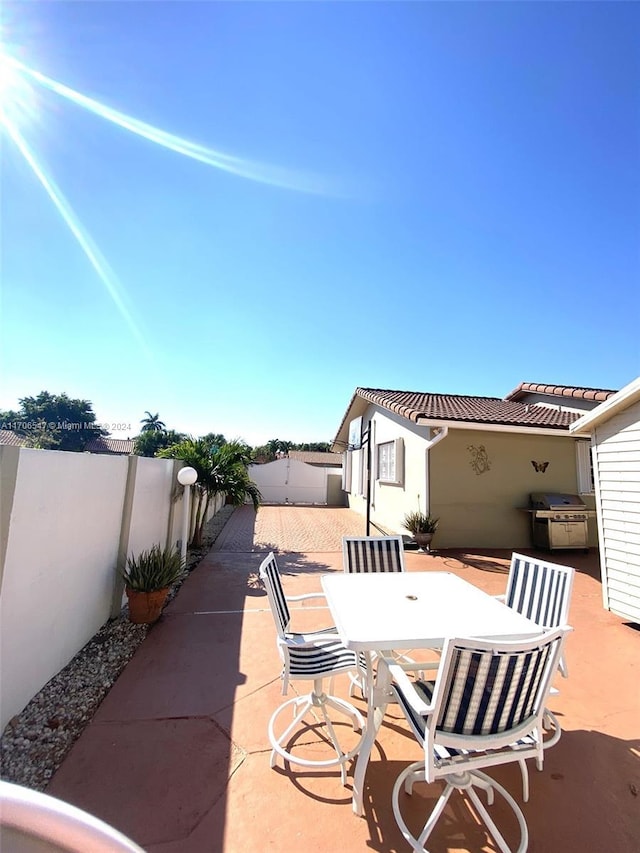 view of patio featuring a grill