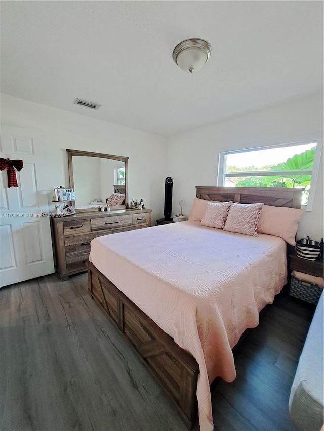 bedroom featuring dark hardwood / wood-style floors