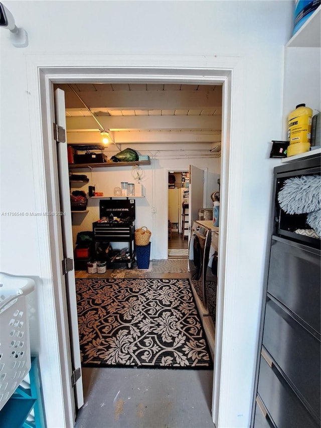 clothes washing area with washer and dryer