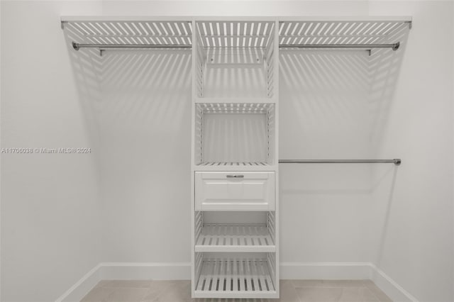 walk in closet featuring light tile patterned floors