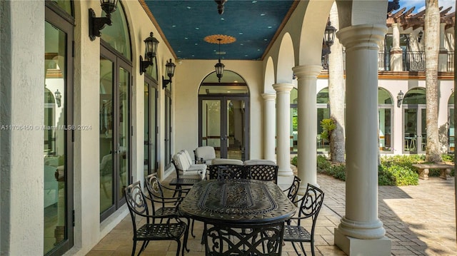 view of patio / terrace featuring a porch and french doors