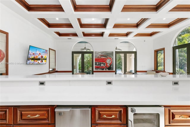 kitchen featuring beamed ceiling, ornamental molding, wine cooler, and coffered ceiling