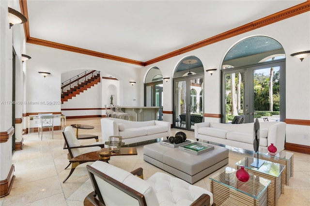 living room featuring french doors and ornamental molding