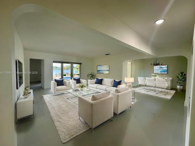 living room featuring a notable chandelier