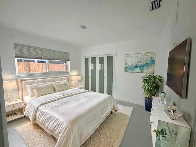 bedroom with concrete flooring