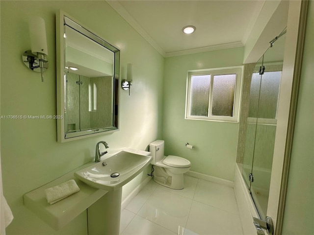 full bathroom featuring sink, combined bath / shower with glass door, tile patterned floors, toilet, and ornamental molding