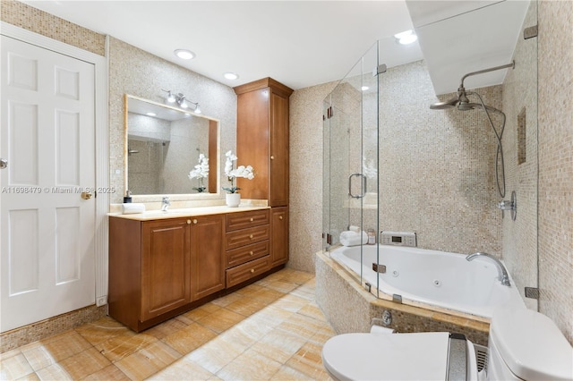 full bath featuring toilet, a stall shower, a jetted tub, and vanity