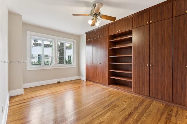 unfurnished bedroom featuring ceiling fan and light hardwood / wood-style floors