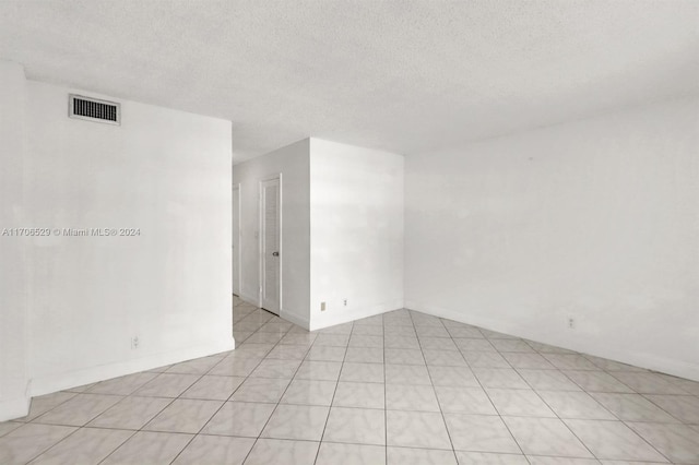 421 NE 14th Ave Unit 203, Hallandale Beach, FL 33009 - empty room with a textured ceiling