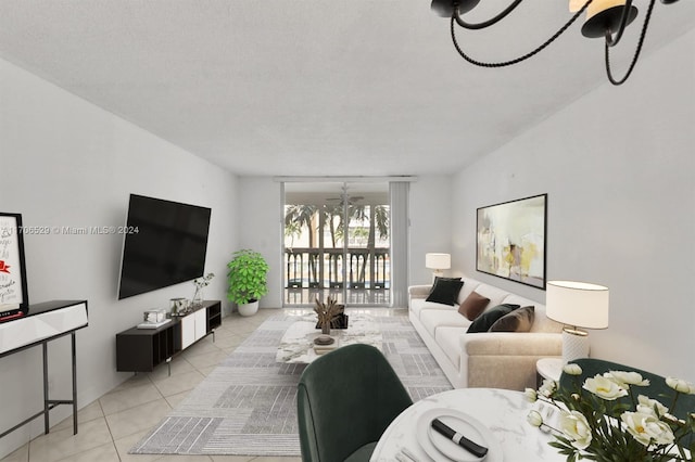 421 NE 14th Ave Unit 203, Hallandale Beach, FL 33009 - living room with light tile patterned floors and a chandelier