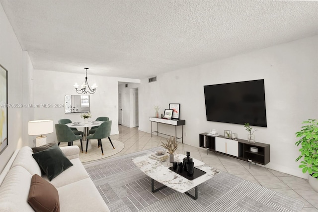 421 NE 14th Ave Unit 203, Hallandale Beach, FL 33009 - living room featuring a chandelier, a textured ceiling, and light tile patterned floors