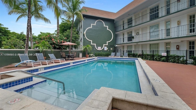 view of pool featuring a patio area