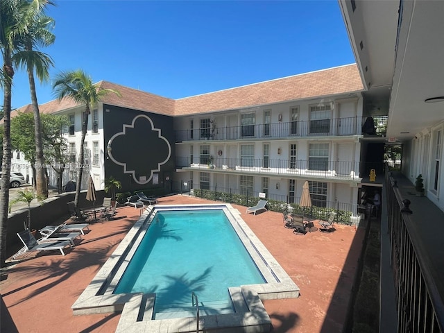 view of swimming pool with a patio