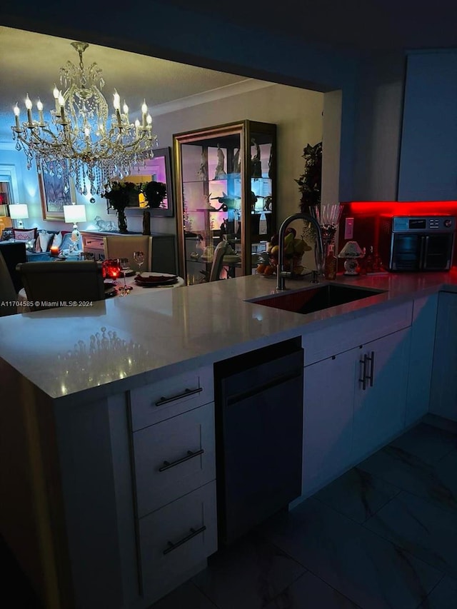 kitchen featuring sink, black dishwasher, a notable chandelier, pendant lighting, and ornamental molding