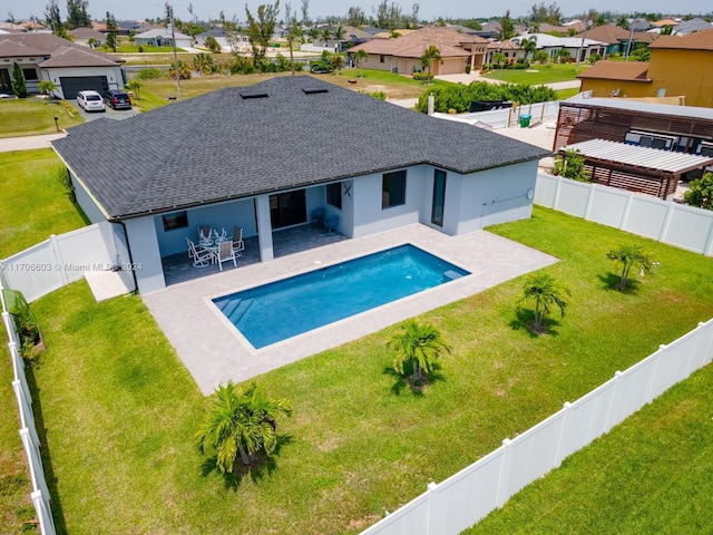 view of pool with a yard and a patio area