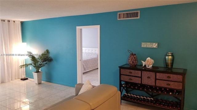 bedroom with light tile patterned floors