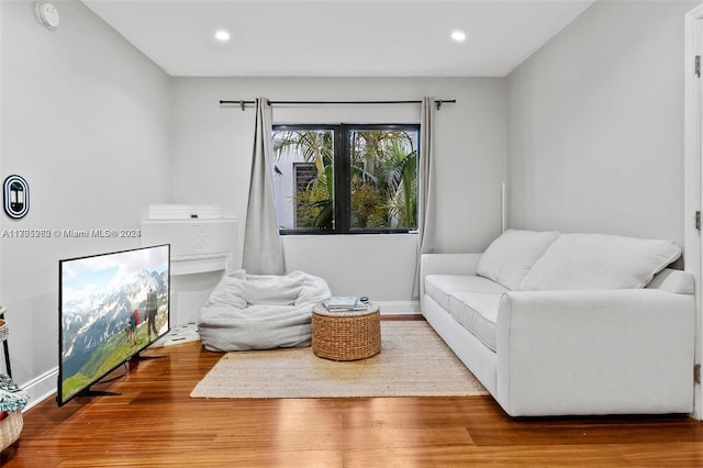 living area with hardwood / wood-style flooring