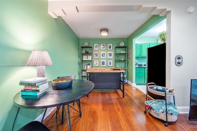 office with light hardwood / wood-style flooring