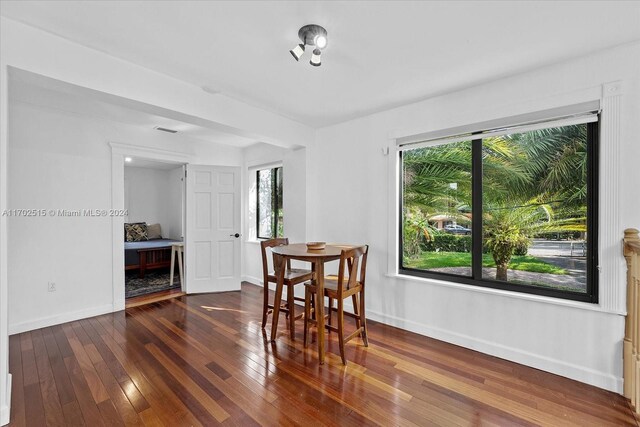 dining space with dark wood-type flooring