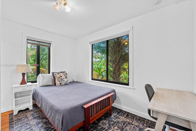 bedroom with hardwood / wood-style floors