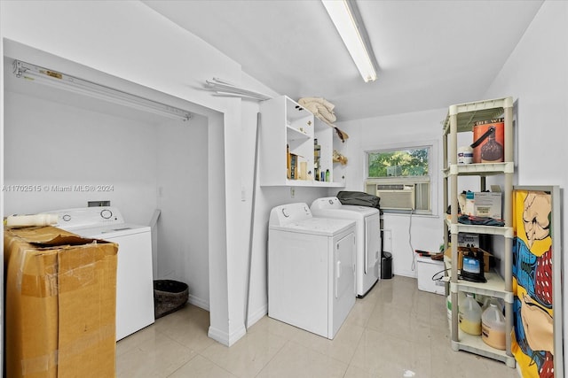 clothes washing area featuring light tile patterned floors, separate washer and dryer, and cooling unit