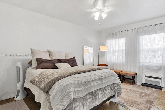 bedroom featuring ceiling fan and tile patterned flooring